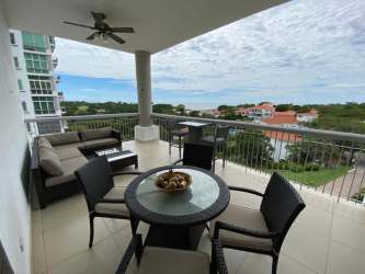 Covered balcony with seating area overlooking ocean and gardens Punta Barco Village Panama