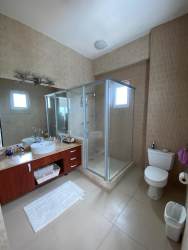 Modern open-concept living space with kitchen, dining and lounge areas Punta Barco Village Panama