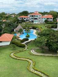 Modern bathroom with glass shower, large mirror and vanity Punta Barco Village Panama