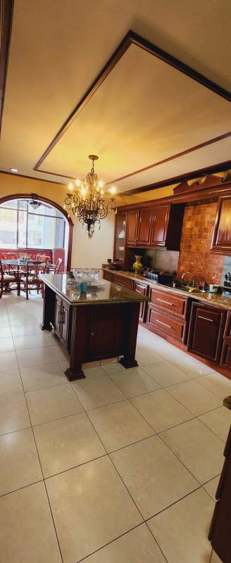 Gourmet kitchen with granite counters and breakfast nook in PH Villa Marina Panama City
