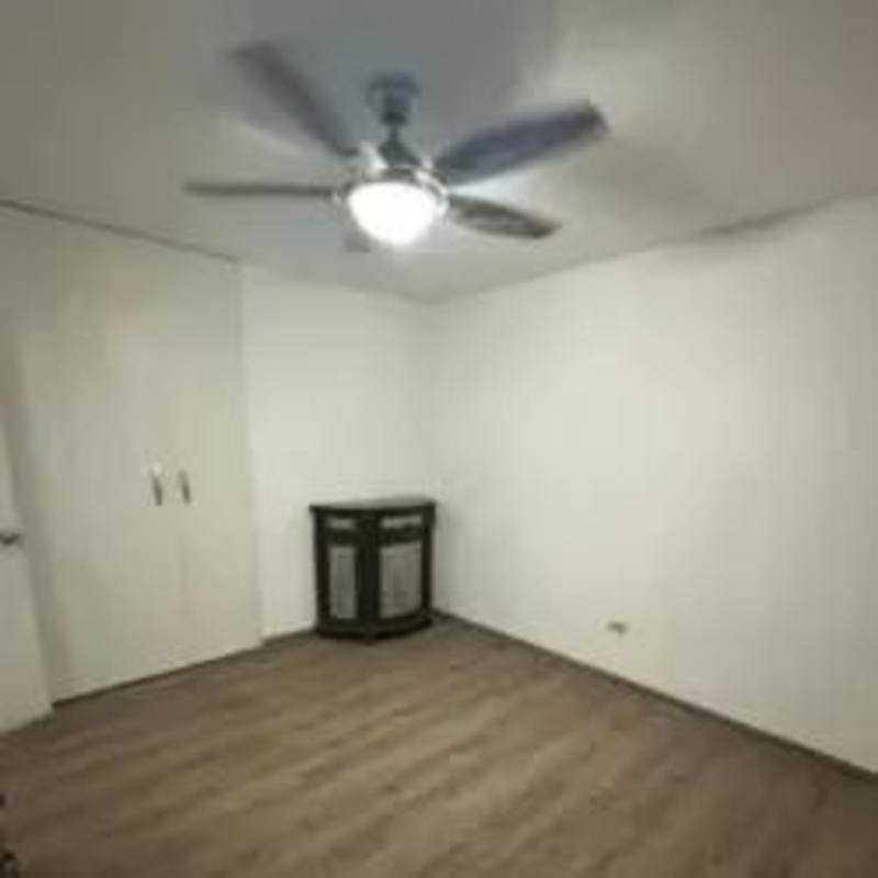 Minimalist bedroom featuring closet, ceiling fan, wooden flooring at PH Montserrat Obarrio Panama