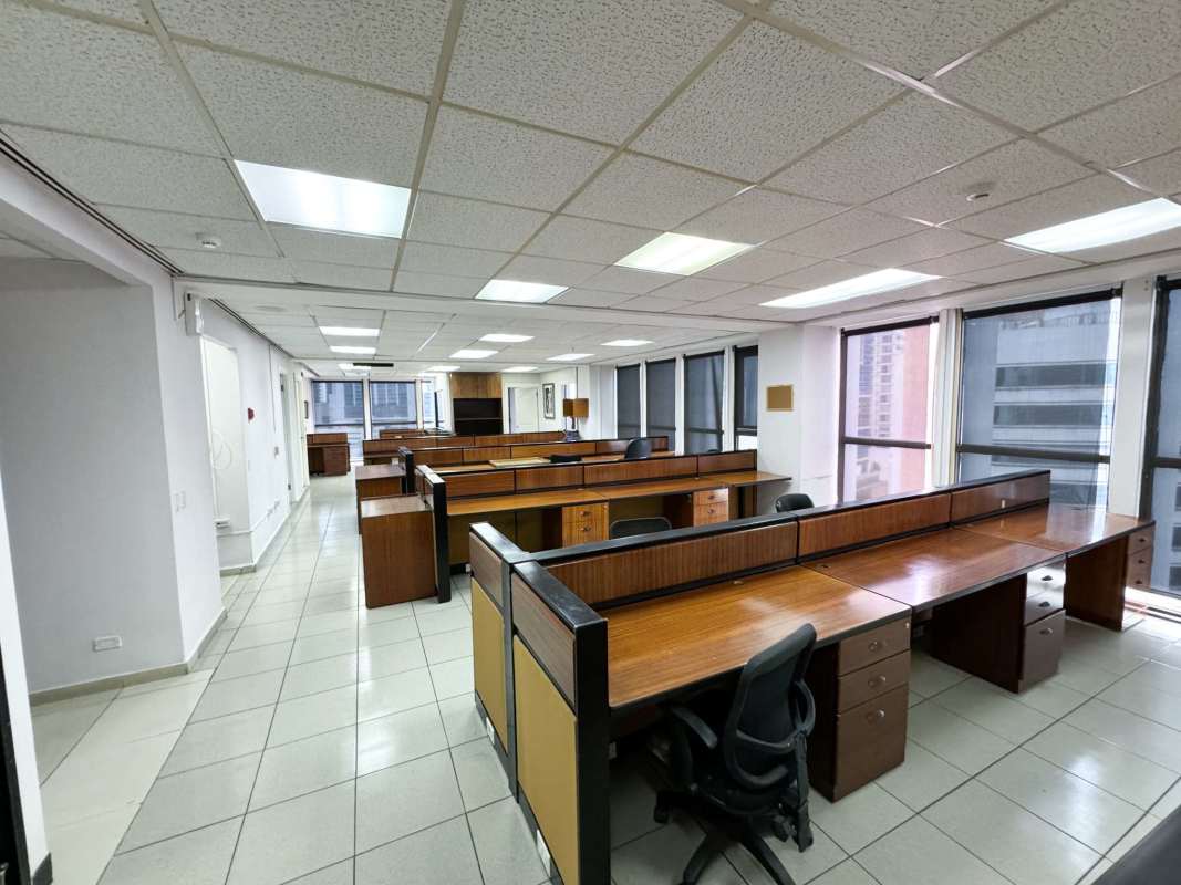 Expansive open office with tiled flooring, partition desks, and panoramic windows PH Humbold Marbella