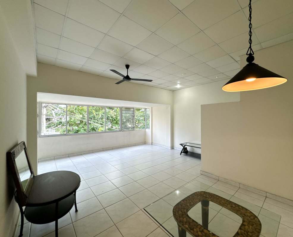 Open living room with large windows, ceiling fan, pendant light, white tile floors in PH America Panama City