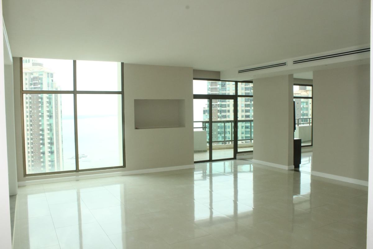 Formal dining room with marble floors and panoramic ocean view in PH Ocean Park Punta Pacifica penthouse Panama