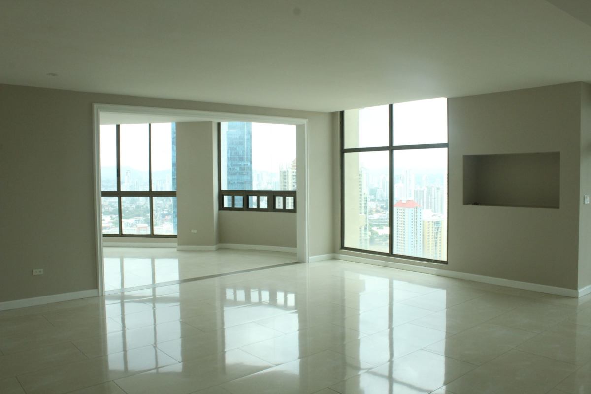 Spacious penthouse kitchen with granite countertops, island, modern appliances, city view at PH Ocean Park Punta Pacifica