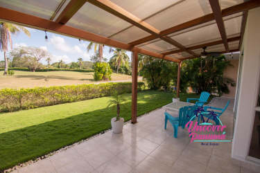 Open kitchen with granite countertops, wood cabinetry, and stainless appliances in Costa Blanca villa Panama