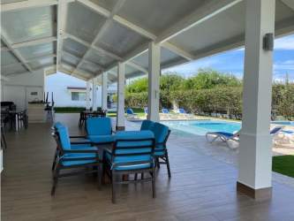 Traditional coastal condo balcony with white railings at Kite Village Punta Chame Panama