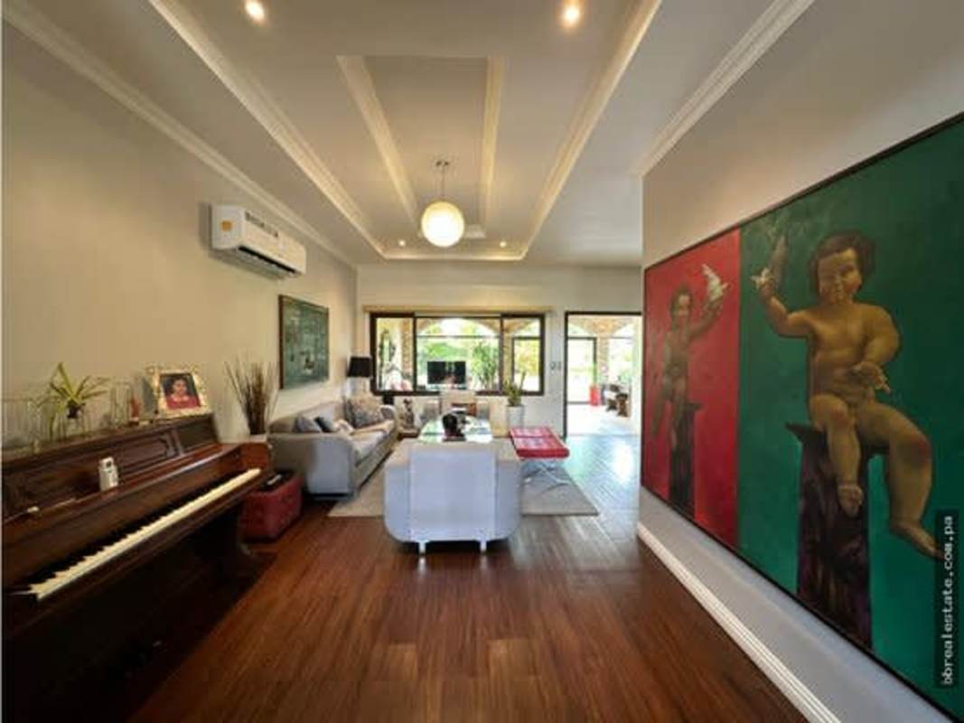 Spacious kitchen with granite countertops open to dining room in Costa Sur Panama