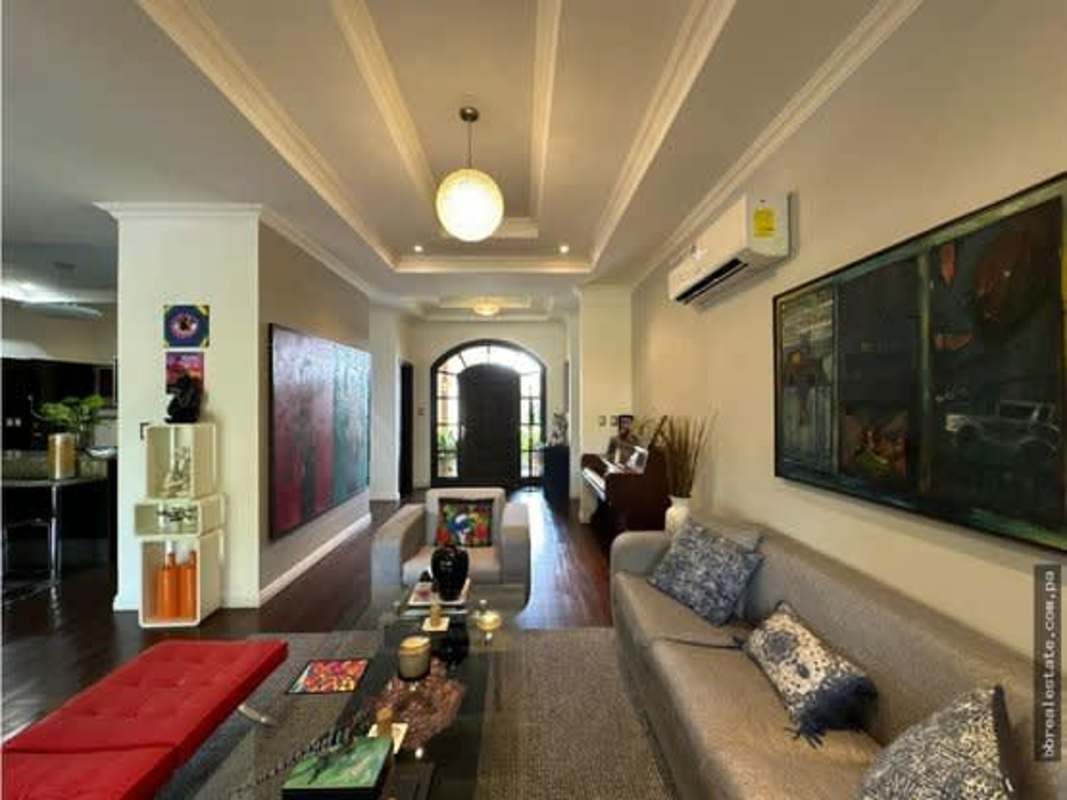 Modern living room with piano wood flooring in luxury home Costa Sur Panama