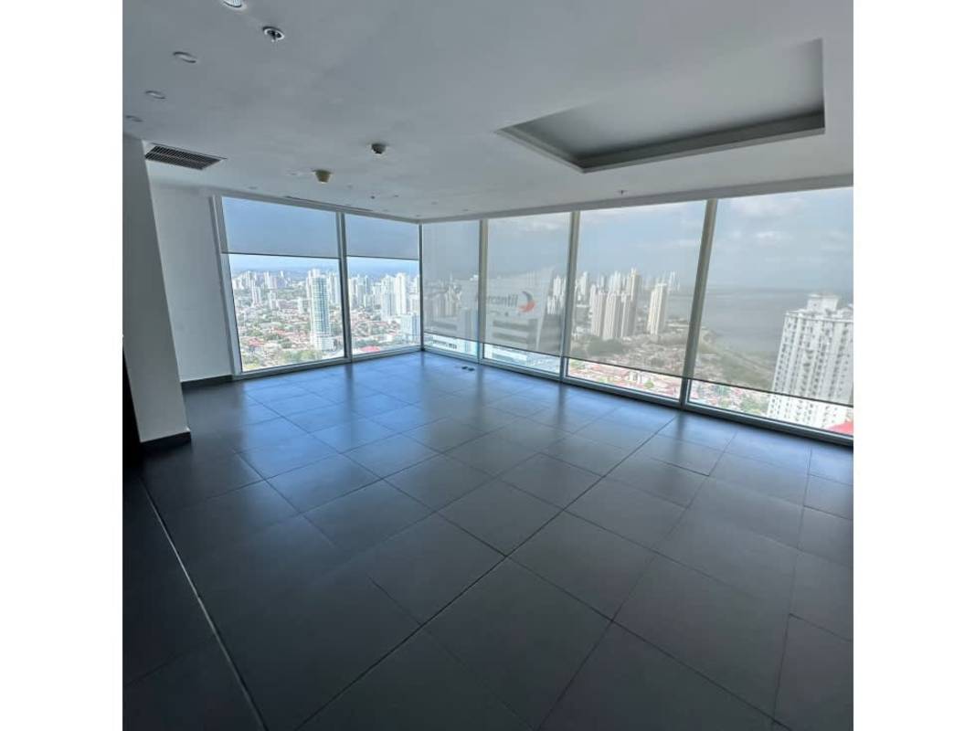 Open corporate lounge with panoramic windows city skyline view Oceanía Plaza Panama