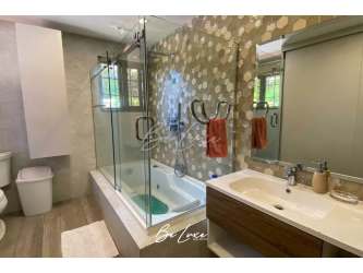 Outdoor terrace with seating area overlooking garden in beach house Las Lajas Panama