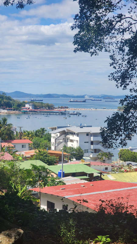 Oceanfront town landscape with hills, boats and houses on Isla Taboga Panama