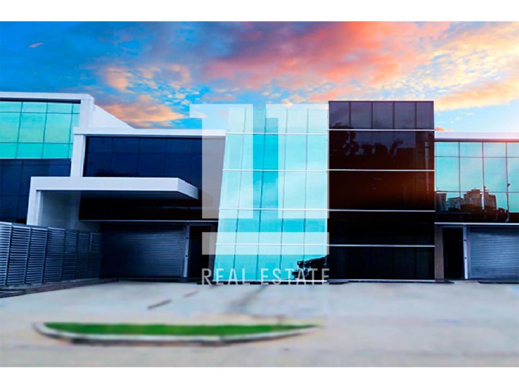 Contemporary commercial warehouse exterior with large windows and metallic finishes in Panama Viejo