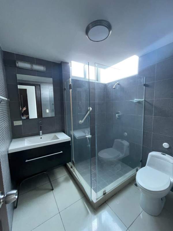 Second bedroom with large window, city views, built-in closet in PH Top Towers Costa del Este Panama