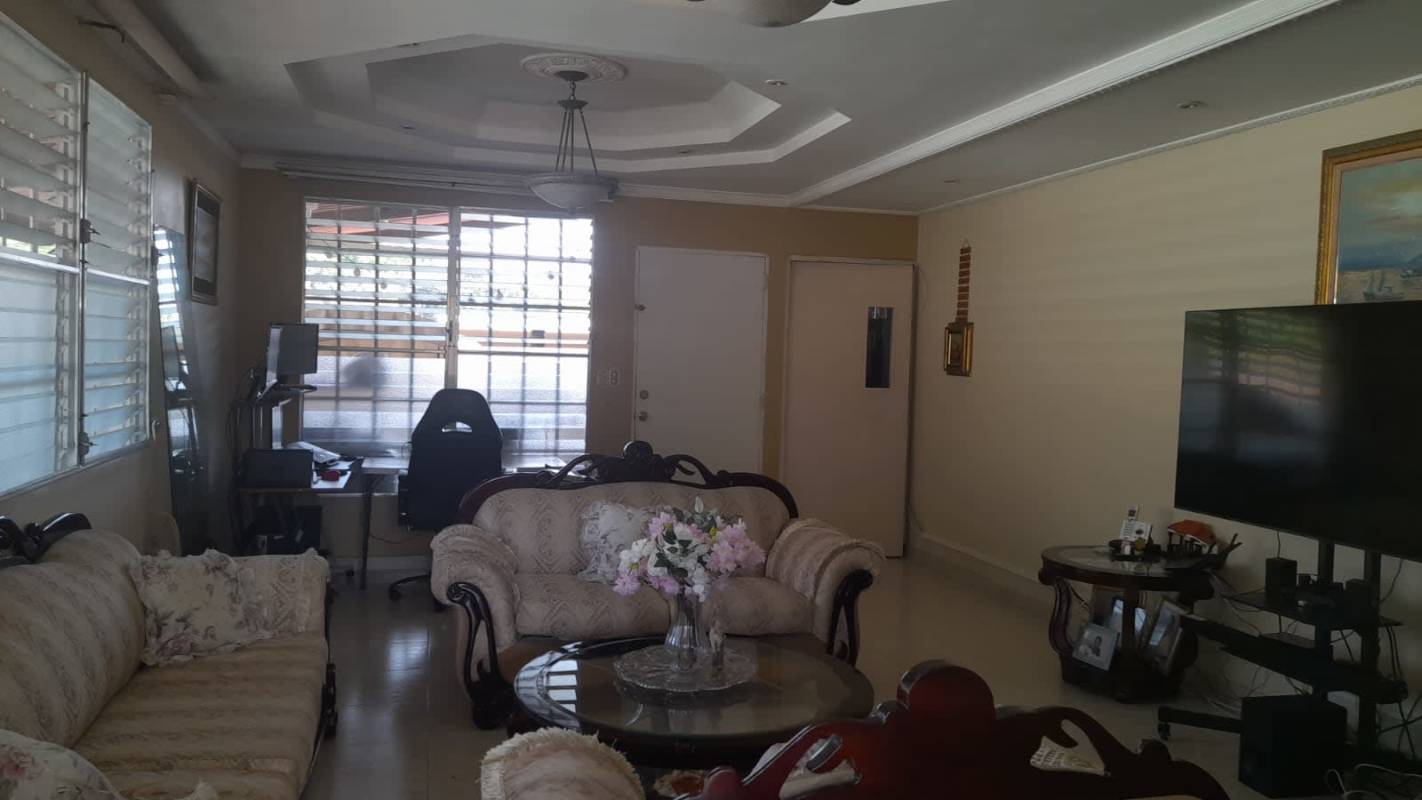 Large covered terrace ideal for outdoor living with view to lush garden in Brisas del Golf Panama house