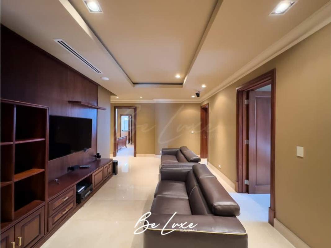 Formal dining area with panoramic windows overlooking Costa del Este and the ocean in PH Panama Bay Tower Penthouse