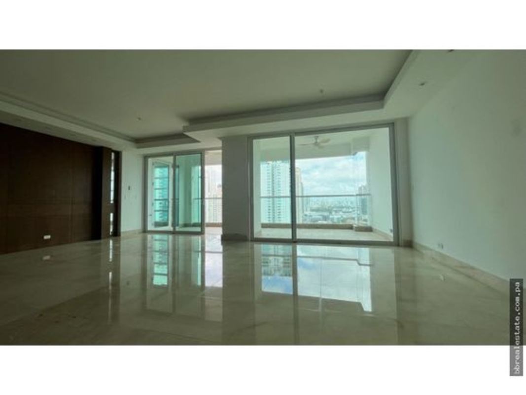 Spacious living and dining room with sliding glass doors to oceanview terrace in PH Aria Costa del Este