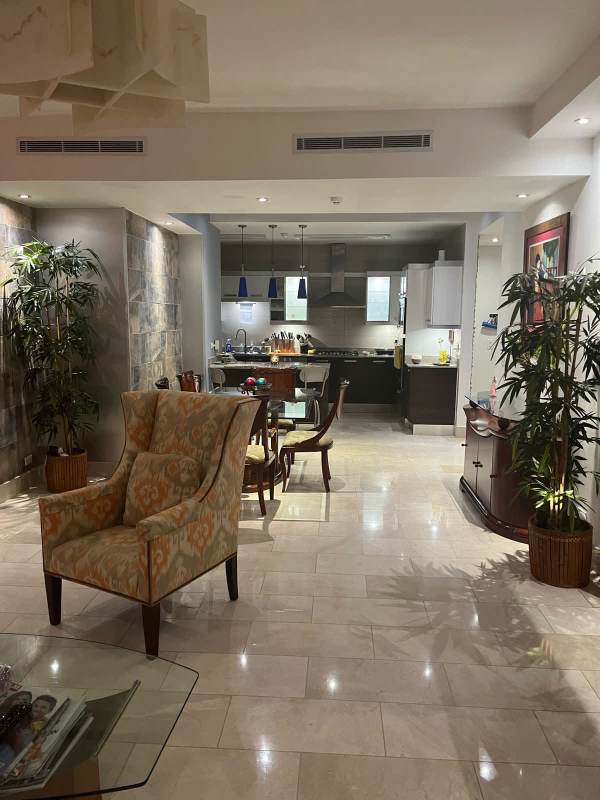 Furnished living dining room marble floors ocean view Grand Tower