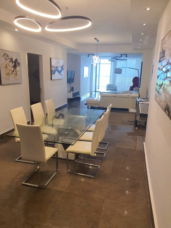 Modern open dining and lounge area in PH Yoo Panama luxury apartment for sale
