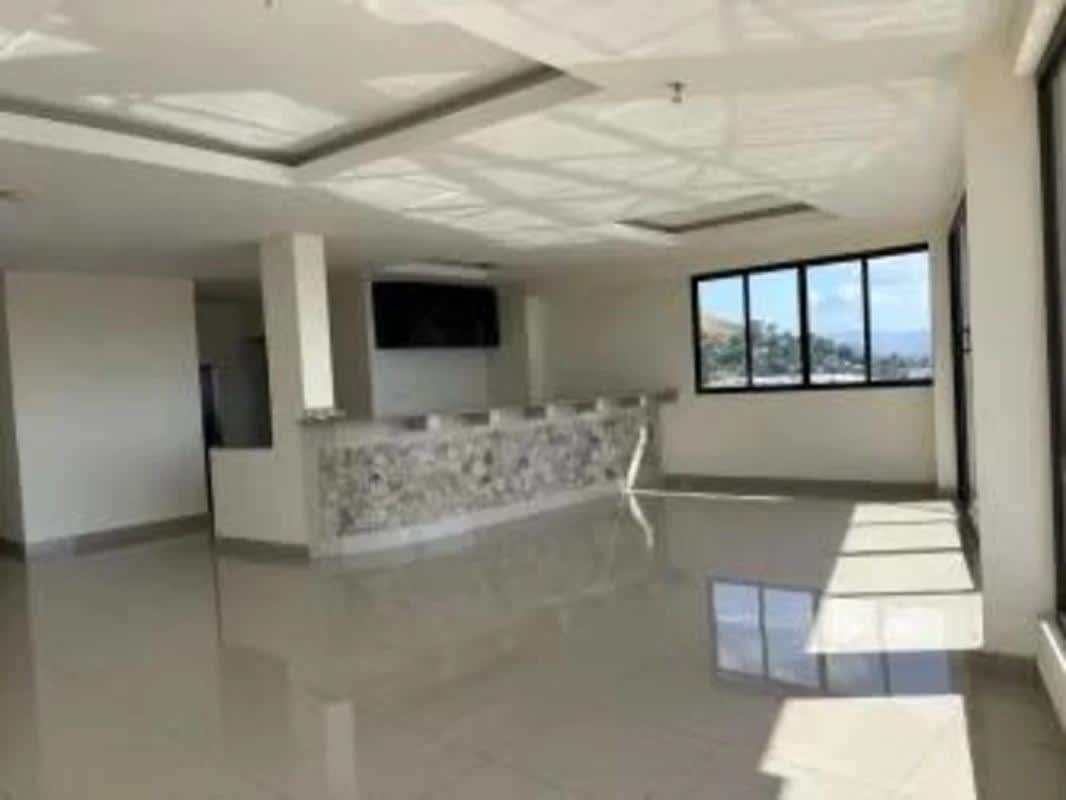 Open layout kitchen with granite countertops, large windows and city views in PH Peake Point Panama City