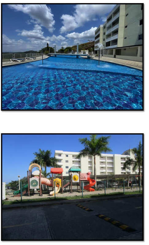 Large swimming pool and children's playground with colorful slides at PH Altamira Gardens in Clayton Panama City