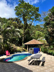 Private pool area with gazebo, picnic table, tropical landscaping mountain house rental Panama