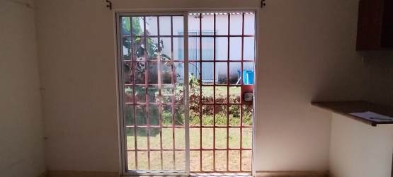 Single family home exterior with covered porch, driveway, and garden, La Chorrera Panama