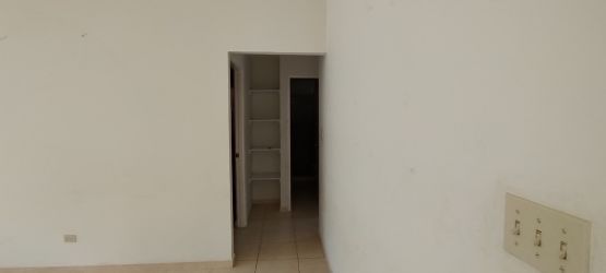 Empty bedroom tiled floor with window overlooking yard in Cluster Los Castaños La Chorrera