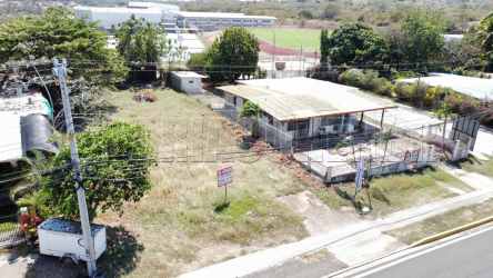 Aerial commercial lot with small building near shopping center in Chitre Panama