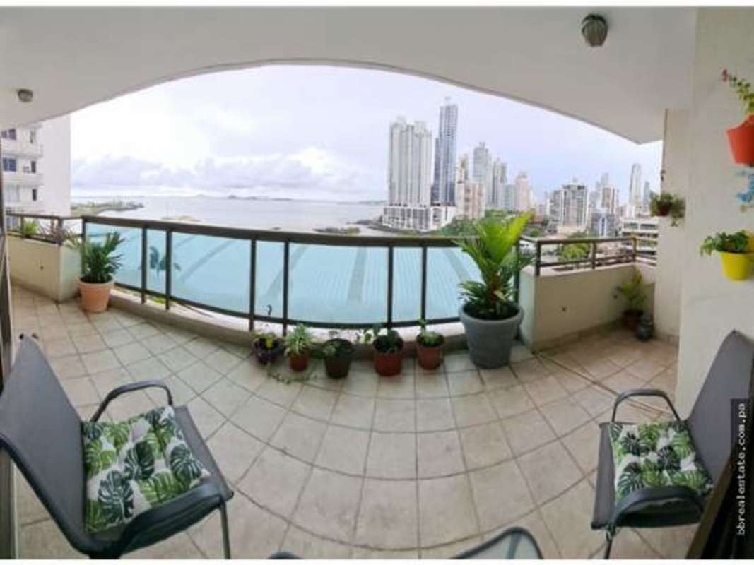 Spacious closed kitchen with appliances and wooden cabinets PH Ocean Park luxury apartment