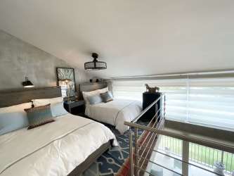 Contemporary bathroom with glass shower enclosure and double vanity at Buenaventura beach loft Panama