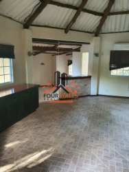 Spacious open interior room with vaulted beam ceiling in rustic Panama villa