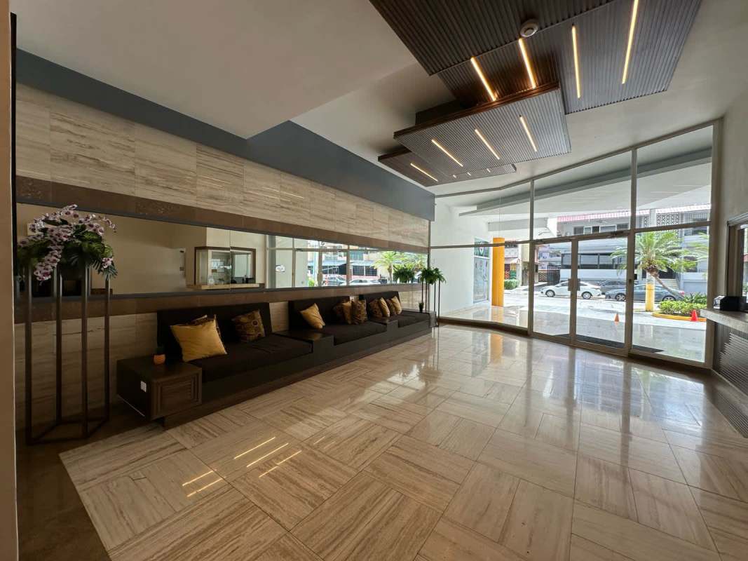 Renovated lobby with reception and modern decor at PH Kubic tower in El Cangrejo Panama City