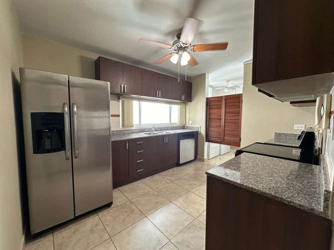 Modern bathroom with granite countertop and shower enclosure at PH Kubic Bella Vista Panama City