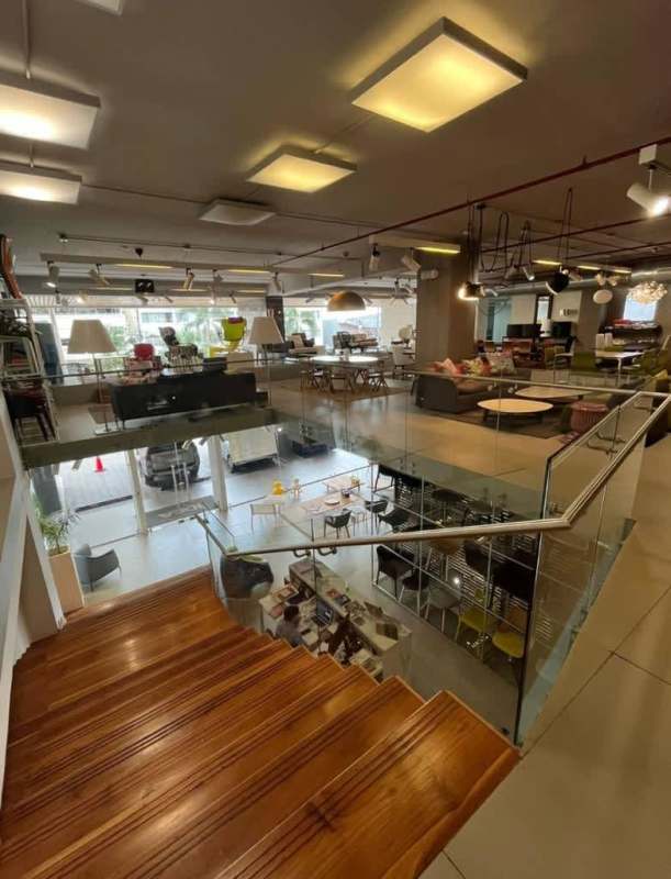 Colorful multi-level facade with parking and retail frontage at Kenex Plaza in Obarrio Panama City