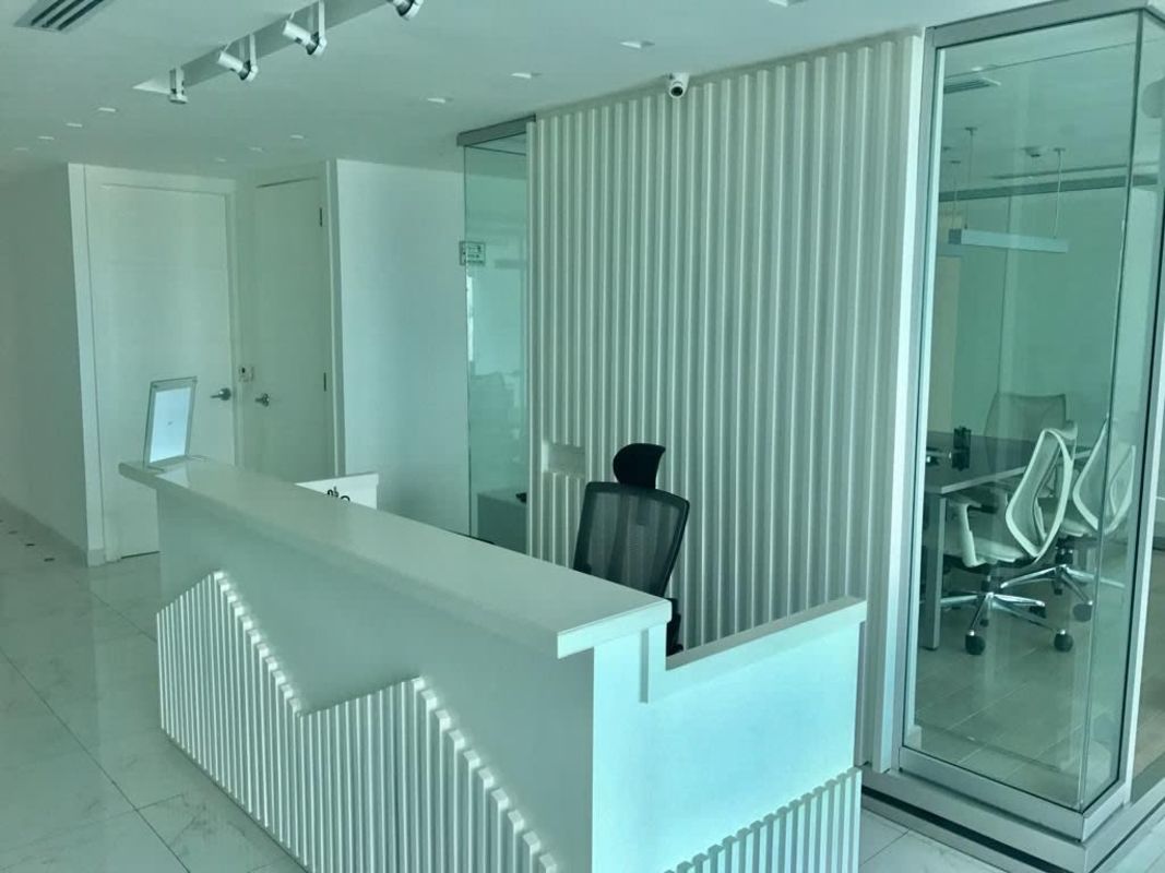 Modern luxury office reception with conference room glass partitions PH Ocean Club Panama