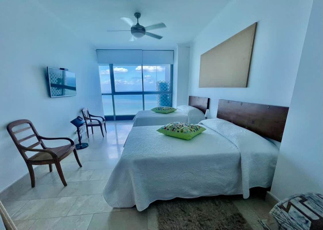 Bedroom with ocean view windows furnished rental Grand Tower Punta Pacífica Panama City
