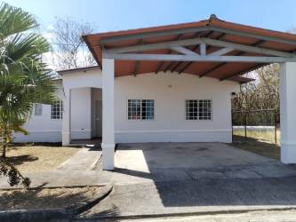 Single story house with covered carport white walls at Residencial Las Villas Penonomé Coclé
