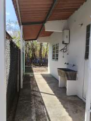 Quiet suburban backyard single story houses lush garden Penonomé Coclé Panama