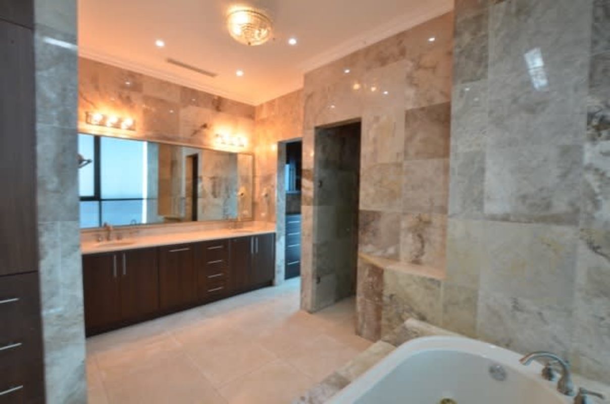 Modern marble bathroom with Jacuzzi tub and double vanity PH Ocean Two penthouse