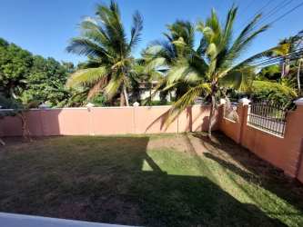 Minimalist spacious bedroom tiled floors built-in closet two windows La Chorrera Panama