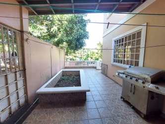 Outdoor patio space with grill planter and security bars house at Guadalupe La Chorrera Panama