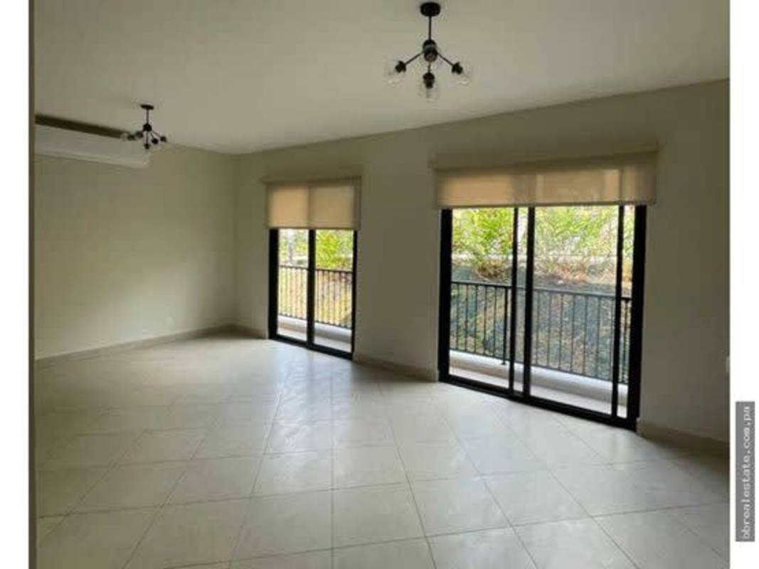 Contemporary kitchen with granite countertops and wood cabinets in PH Embassy Gardens Clayton