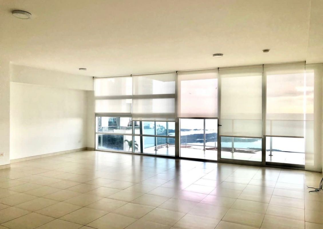Spacious living area with balcony overlooking ocean PH Waters Panama City