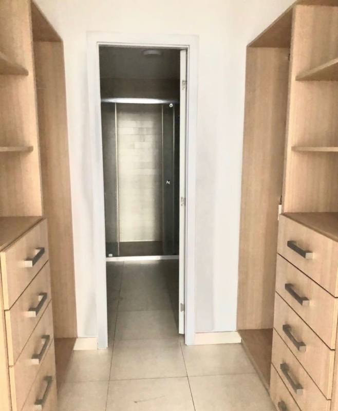 Modern open kitchen and dining area in PH Waters apartment Panama City