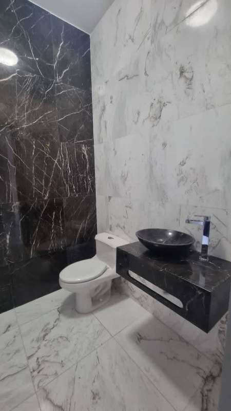 Laundry room with stacked washer dryer and large window PH Regalia Costa del Este Panama