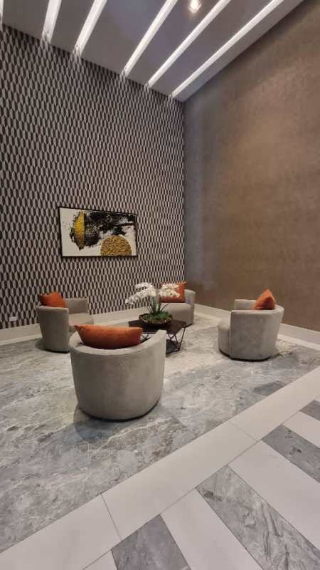 Lobby lounge area with modern art wall and chairs PH Regalia Costa del Este Panama