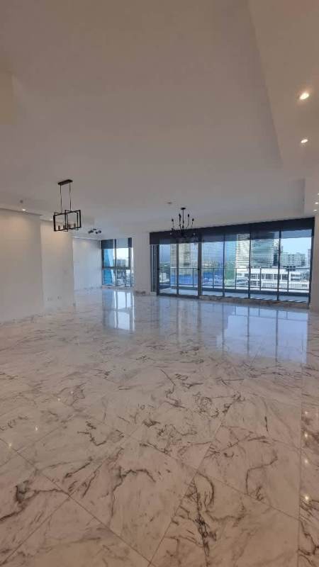 Bright living room with marble floor and wide glass windows PH Regalia Costa del Este Panama