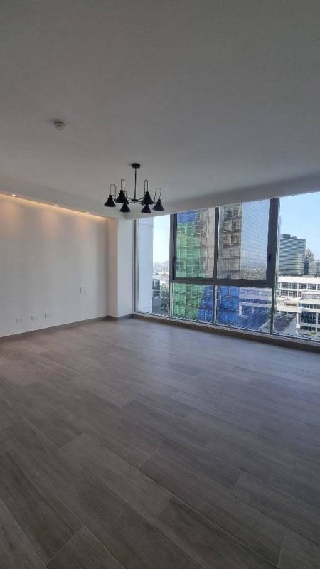 Open living and dining area with floor-to-ceiling windows and terrace overlooking ocean in PH Regalia Costa del Este Panama