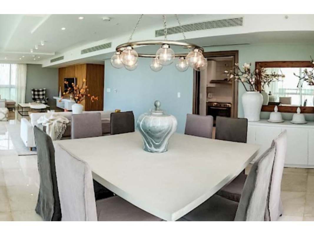 Bright dining area with large windows and modern furnishings PH Park Lane Costa del Este Panama